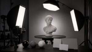 3D lighting studio with clay bust on turntable three softbox lights camera and material spheres